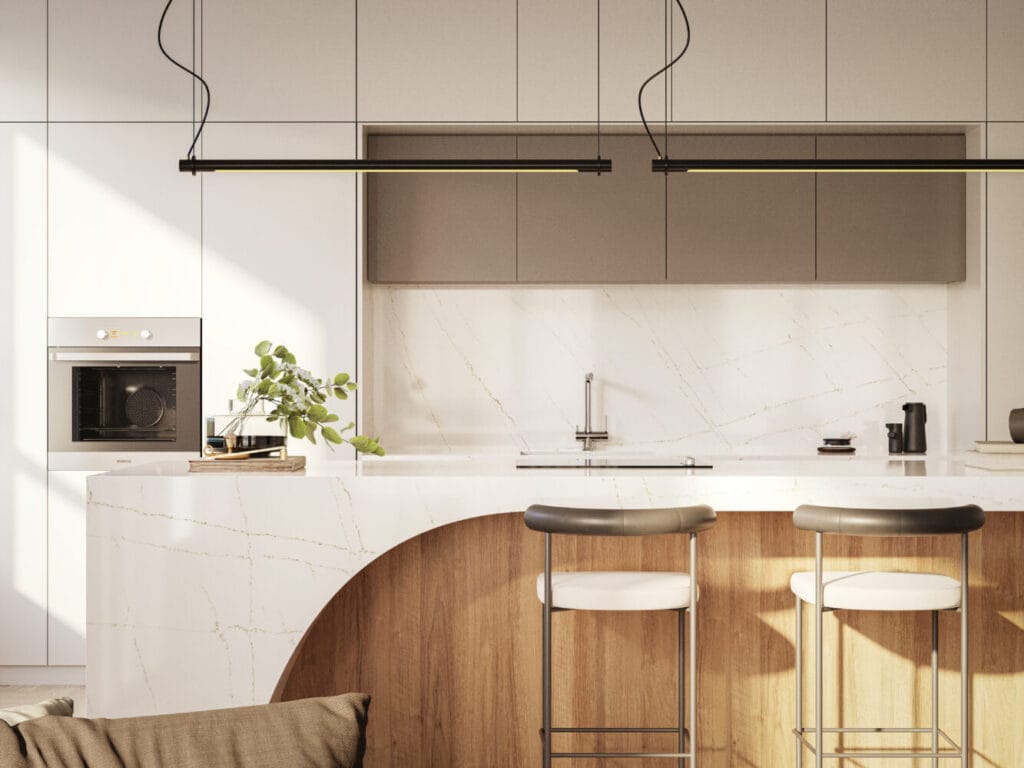 Cuisine moderne avec îlot central et chaises hautes.